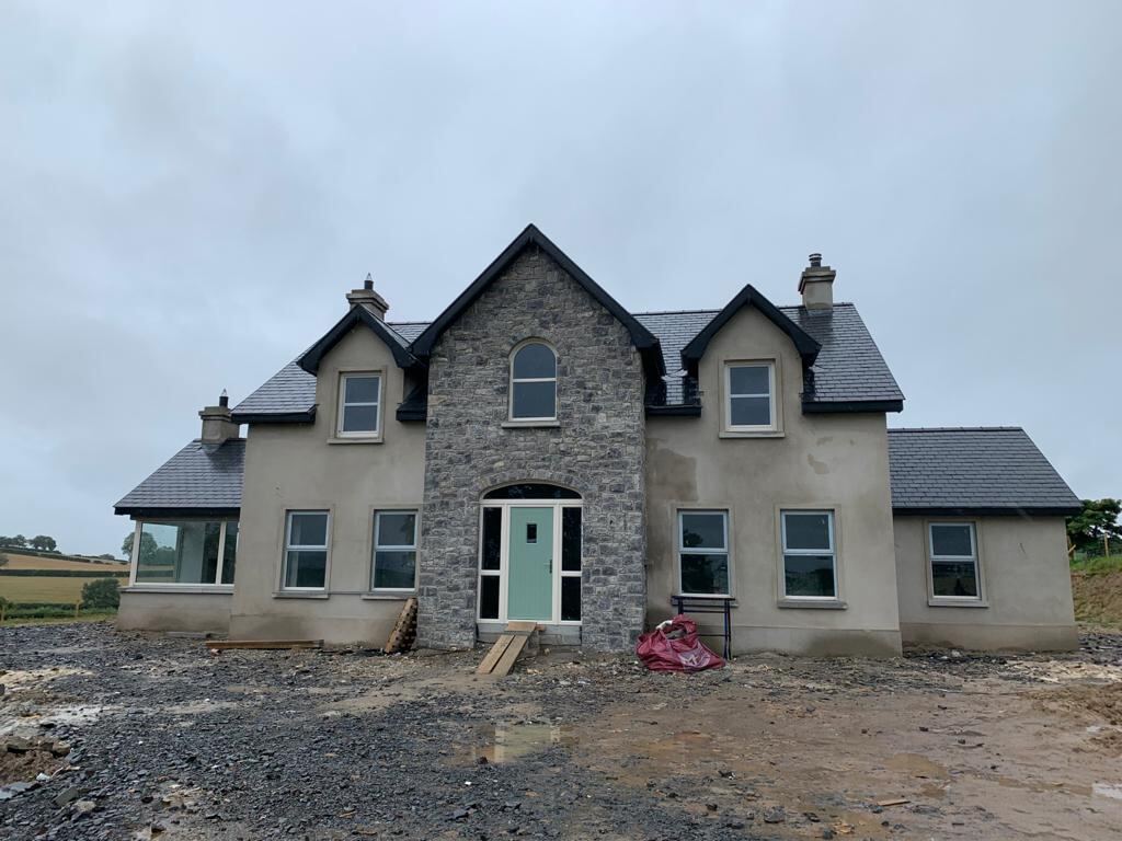 Detached new build with a finished slate roof