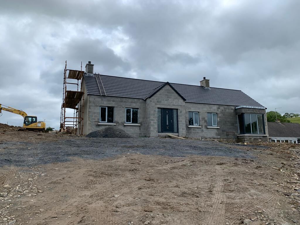Single storey new build with a completed slate roof